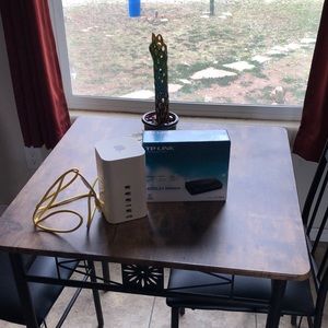 Apple Tower Extreme Base Station router and unused new TP-Link ADSL2+ Modem.